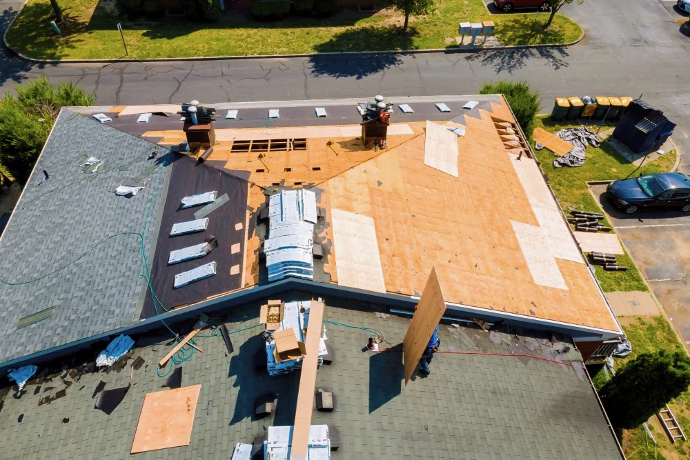 Roof decking exposed after tear-off, ready for inspection before new underlayment